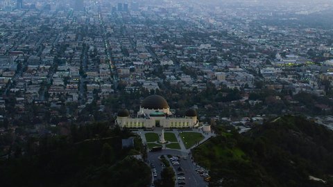 
Great view of the Griffith Observatory in Mount Hollywood. Los Angeles, California. Downtown skyline with its famous skyscrapers during sunset. Shot on Red Weapon 8K.