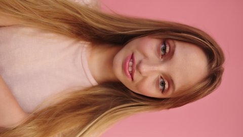 Vertical Video, Happy Young Female Posing to Front Selfie Camera POV, Isolated on Pink Background, Full Frame