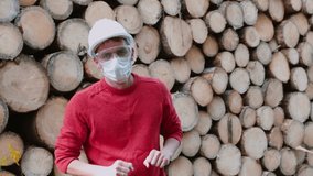 Deforestation problem. Video blogger takes off  mask and starts online conversation. Theme  blog is logging trees. Communication with subscribers at distance in a social distance. 