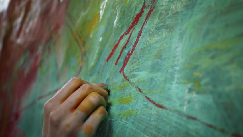 Artist's Hand. Girl Paints Picture With Her Hand. Hand In Paint. Girl Paints On Canvas. Royalty-Free Stock Footage #1058859829