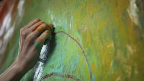 Artist's Hand. Girl Paints Picture With Her Hand. Hand In Paint. Girl Paints On Canvas.