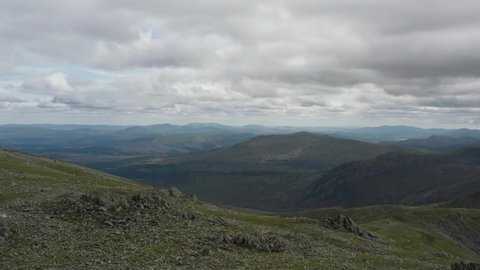 High elevated scenic panoramic from the Carnedd Llewelyn summit in Snowdonia Wales.