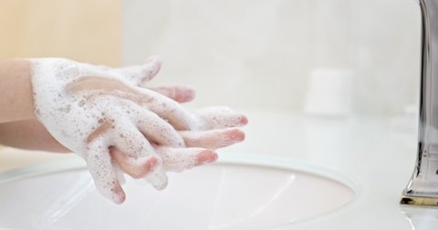 Child is washing  his hands with a hand wash gel in sink. Clean hand concept idea. Health care Coronavirus protection.Closeup view. Health care concept. 