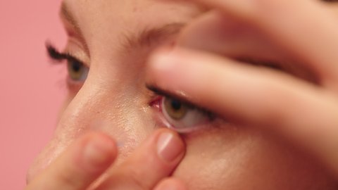 Close Up of Female Putting Contact Lens on Eye. Ocular Device, Vision Correction Static Full Frame