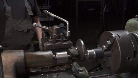 Footage of working process with metal details on lathe