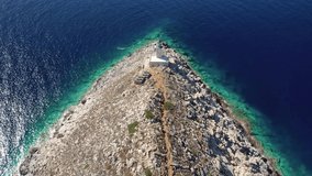 Aerial drone video of iconic lighthouse in scenic Cape Matapan or Tainaron the Southmost part of mainland Greece, Mani, Peloponnese, Greece