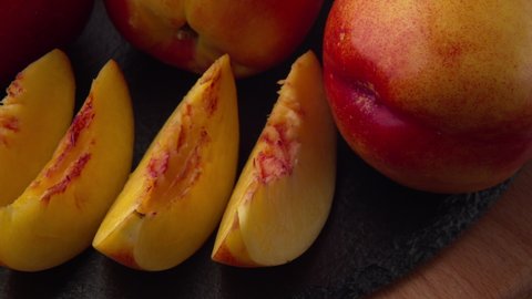 Sweet fresh nectarine with slices dolly-shot in natural light close-up. 4k ProRes 422