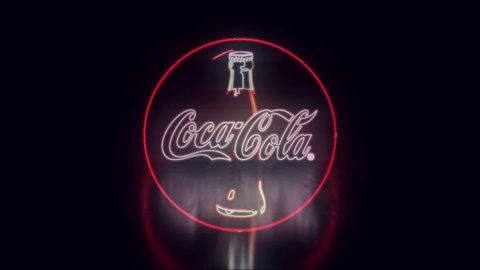 Coca Cola logo neon sign light on black background New quality universal vintage motion dynamic animated background colorful video. Neon text: Chita. Russia. 13.09.2020