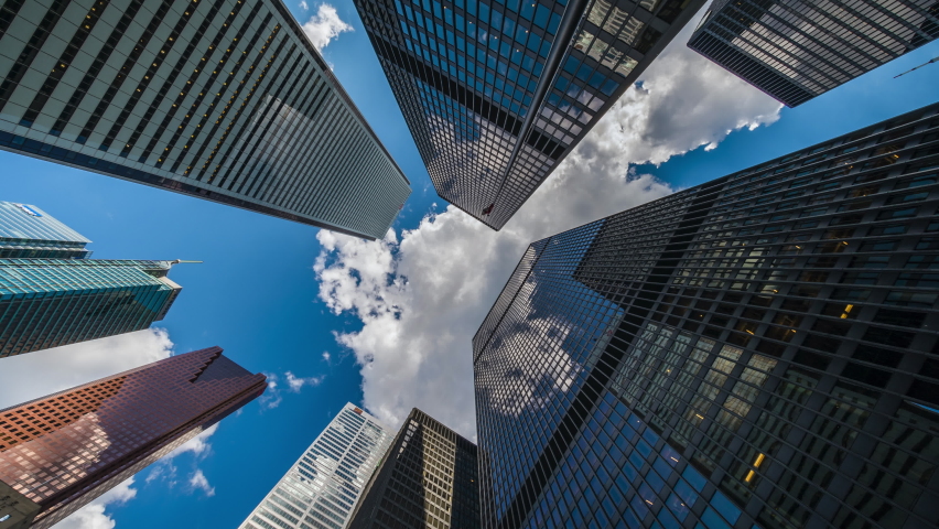 Looking up at high rise office building architecture against blue sky in  the financial district of Toronto in Ontario, Canada, business and finance  concept. Stock Photo