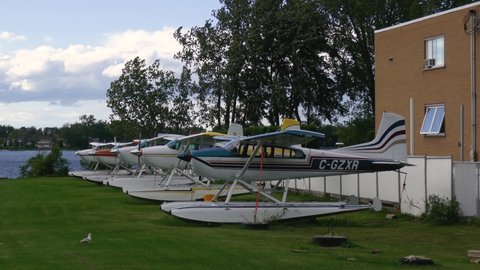 Seaplanes being placed for storage on the grass. MONTREAL CANADA SEPTEMBER 2020