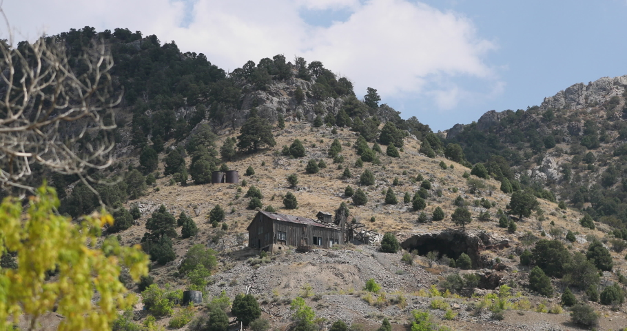 Old Mine tunnel building abandoned Mammoth Utah desert. Mines in the area around Mammoth produced ore, silver, and gold. High mountain desert environment.