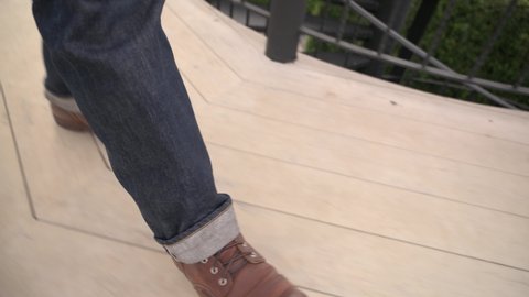 Feet walking on the wooden floor
