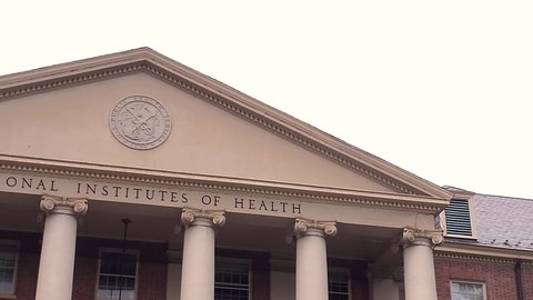 Bethesda, MD, USA: 09/12/2020: View of the main historical building (Building 1) of the National Institutes of Health (NIH) inside Bethesda campus. U.S. Public Health Service seal is seen on top of it