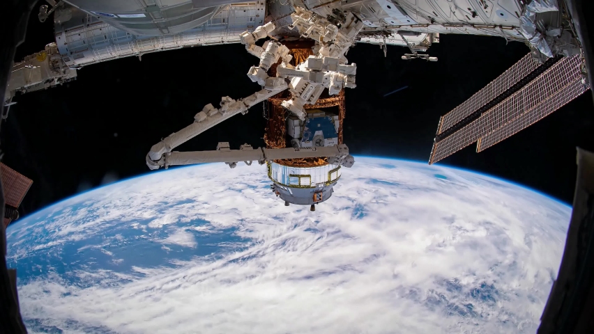 4K time lapse of Earth from Space featuring the Canada Arm module of the International Space Station. Image courtesy of NASA. | Shutterstock HD Video #1058934614
