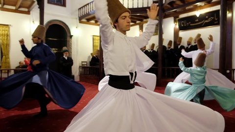 Bursa, Turkey - October 13, 2019: Semazen ceremony. Sufi whirling dervishes dances in Turkey. Sufi whirling is a form of physically active meditation. Slow motion
