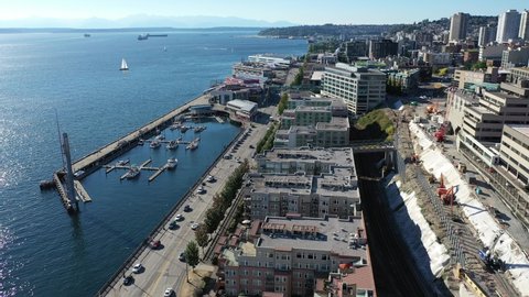 Seattle , Wa / United States - 09 04 2020: Aerial / drone footage of the Seattle Cruise Ship Terminal, waterfront, Belltown, Elliott Bay without people downtown, in the commercial district of Seattle,