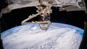 4K time lapse of Earth from Space featuring the Canada Arm module of the International Space Station. Image courtesy of NASA.