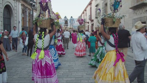 Oaxaca de Juárez, Oaxaca/Mexico - March 10 2020: Some mexican disguised women dancing in the street in a town celebration