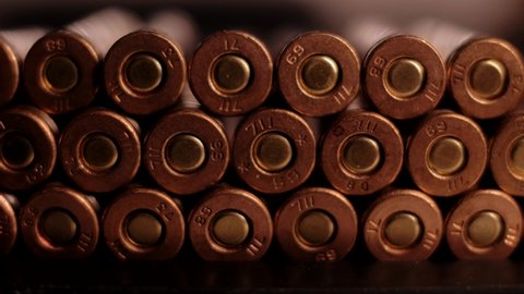 Bullets with casings inside the weapon. Close-up