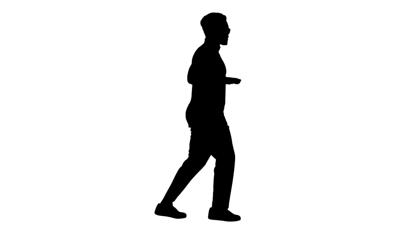 Silhouette Young african american man in grey clothes and glasses grooving while walking.