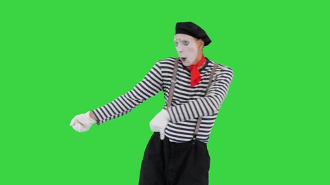 Mime pulling an imaginary rope on a Green Screen, Chroma Key.