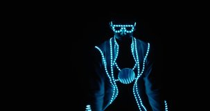 Professional dancer at the club in glowing lights dancing on stage, 4k