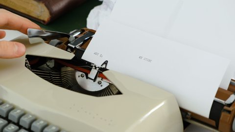 Typing words My story - Typing with a compact retro vintage typewriter. Close up