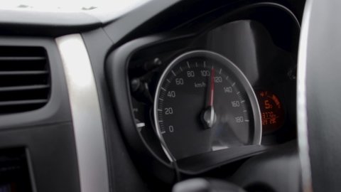 Fast Driving car a speedometer 100 plus kilometers per hour display front passenger view point close up slow-mo b roll vidoe clip