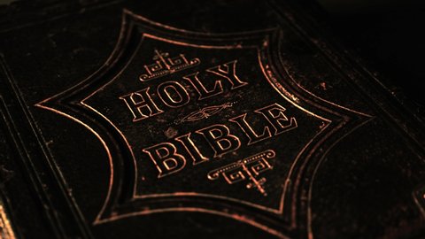 close up of the holy bible with a dark background