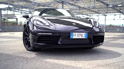 BOLOGNA, ITALY - AUGUST, 2020: Porsche 718 Cayman parked in the street. Porsche is a German automobile manufacturer specializing in high-performance sports cars, SUVs and sedans founded in 1931.