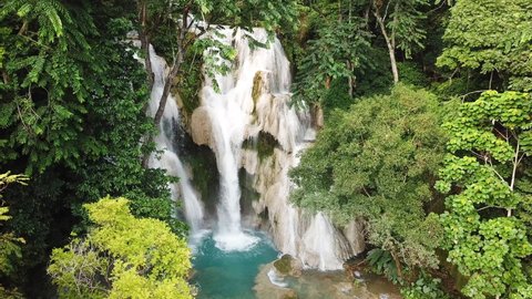 Incredible Exotic Waterfall Rainforest Aerial Scene. Kuang Si Cascade Falls and Natural Pool Paradise