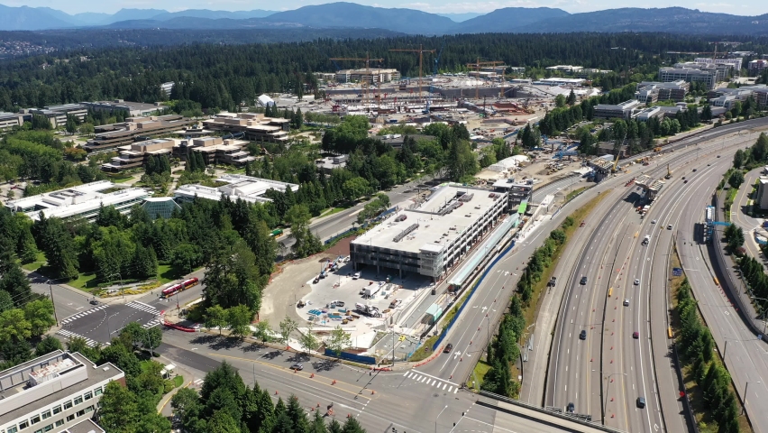 Drone footage, dolly shot of construction and the freeway in Redmond, Washington around the Microsoft corporate headquarters