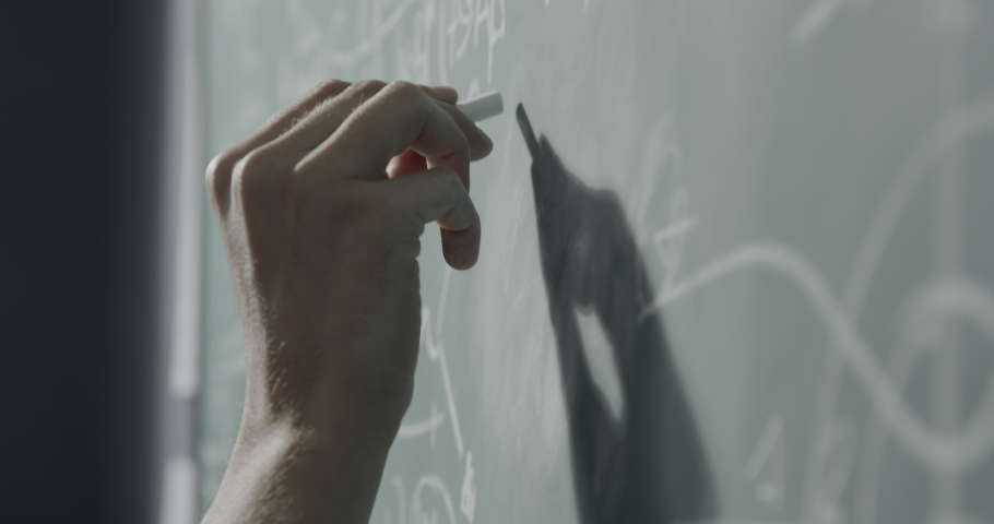 Creative mathematician writing formulas on the chalkboard, hand close up: academic research and science concept Royalty-Free Stock Footage #1059008315