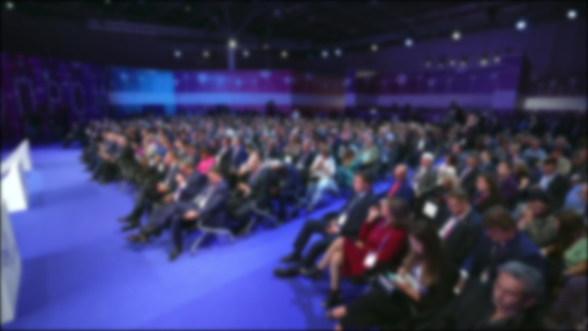 Crowd people listen speaker. Audience business meet forum. Auditorium viewer listen speaker. political summit business man. Group people listening speech crowd.