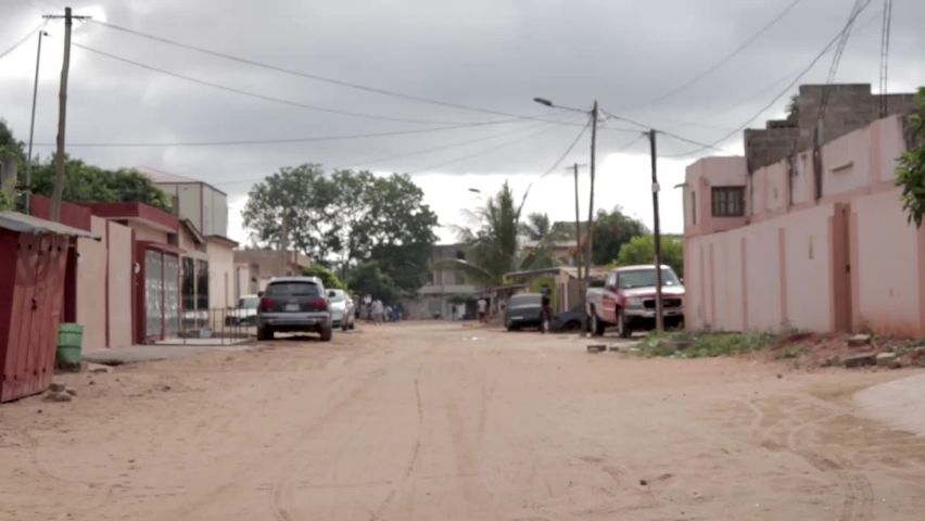 Typical street of the city of Lome, Togo, Africa in the afternoon. Summer 2019.