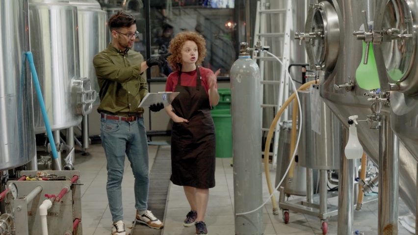 Man and woman working in craft brewery