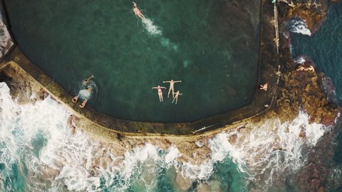 Aerial video of a family enjoying a natural pool in the Atlantic ocean of Tenerife, Canary Islands
