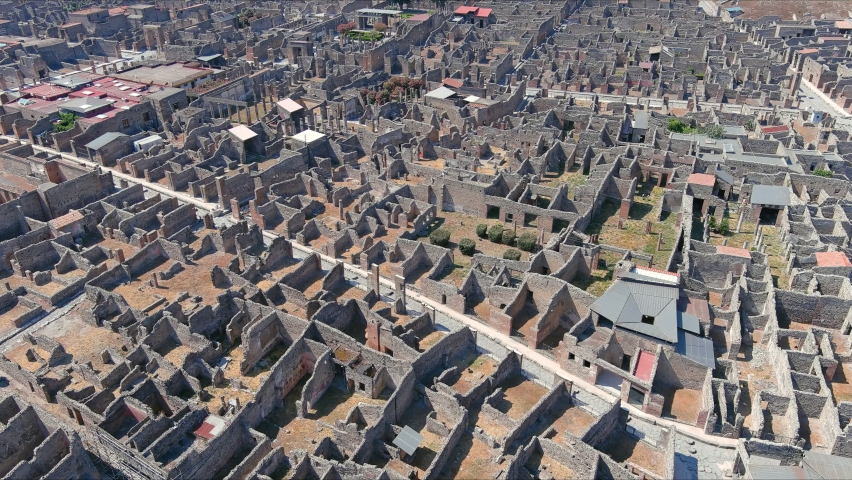 Aerial view of Pompeii, ruins of  ancient Roman city destroyed by volcanic eruption of volcano Mount Vesuvius - landscape panorama of Naples from above, Campania, Italy, Europe