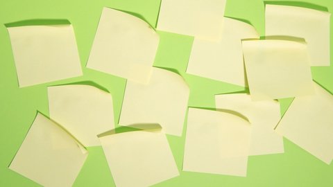 Many note paper on a green background - Stop Motion Animation