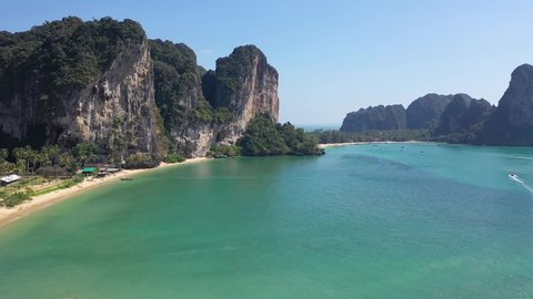 Railay beach, Krabi Province, Thailand - 3d January, 2020: Transportation in Thailand. Seascape with traditional thai long tail boats.