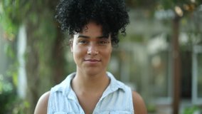 Young African American woman putting surgical mask. Black girl wearing covid pandemic mask walking towards camera - Powered by Shutterstock - Get 15% off with code: PIKWIZARD15
