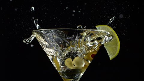 Super Slow motion shot of ice cube splashing into Dry Martini Drink