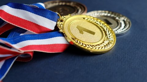 concept for winning or success. Gold medal, silver medal and bronze medal on yellow background. video stock footage