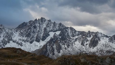 View of snow-capped mountains near Fenetre lakes in Switzerland. Time lapse