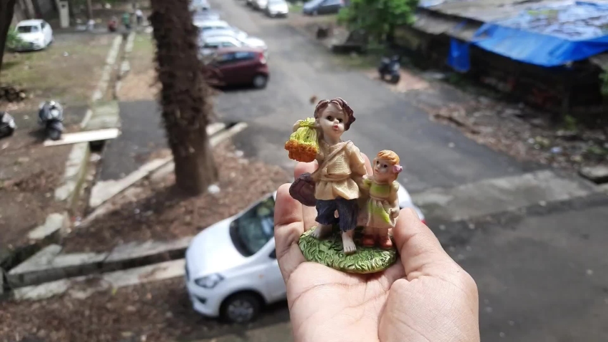 A small statue of brother and sister
