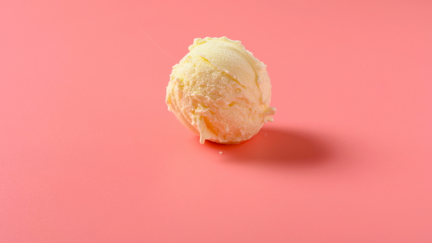 side view vanilla flavor ice cream ball melting timelapse on a pink background at 8K resolution Royalty-Free Stock Footage #1059072773