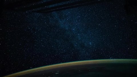 4K timelapse of earth seen from space featuring earth glow and stars of milky way. Image courtesy of NASA.