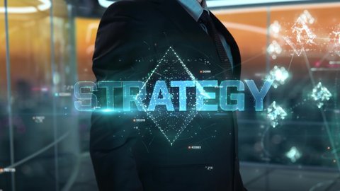 Businessman with Strategy hologram concept