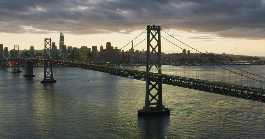 Amazing aerial view of the San Francisco Oakland Bay Bridge during rush hour. Financial District skyline in the background. Interstate 80, California, US. Shot on Red weapon 8K.