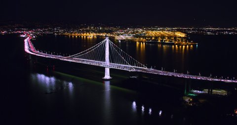 Aerial view of the San Francisco Oakland Bay Bridge during rush hour, full of traffic. Yerba buena and Treasure Island in the background. Interstate 80. California, USA. Shot on Red weapon 8K.